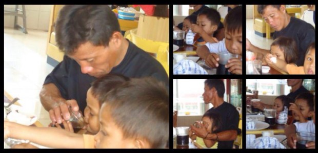 Rolando Pamplona and his children eat at Andok's