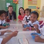 ADB's Karin Schelzig and Madeline Dizon with some of the kids in Macario Natividad Elementary School, Barangay Gargato, Negros Occidental