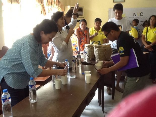 NVC Trustee Mariel Tolentino demonstrates the preparation of Mingo Meals while Cong. Leni Robredo translates the instructions in Bicolano