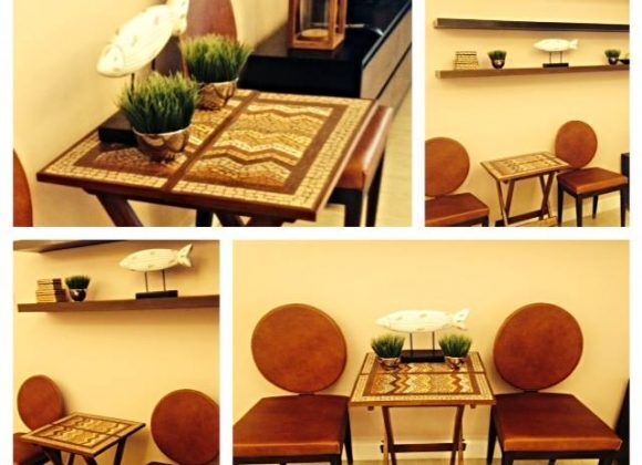 Mosaic folding table adorns a rental condo Mosaic folding table adorns a rental condo