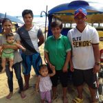 The Calvadores family, survivors of typhoon Haiyan, receives a tricycle from British American Tobacco