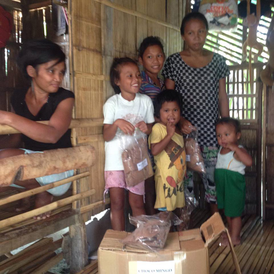 Joven at home with his family and a packet of Mingo choco. His siblings include Diana, 15, Geraldine, 13, Ivy, 9, and En-en, 6.