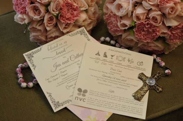 The couple's wedding invitation, which prominently displays the NVC logo!