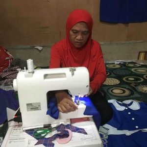 Lilang Ala sews school uniforms