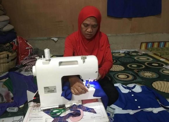 Lilang Ala sews school uniforms